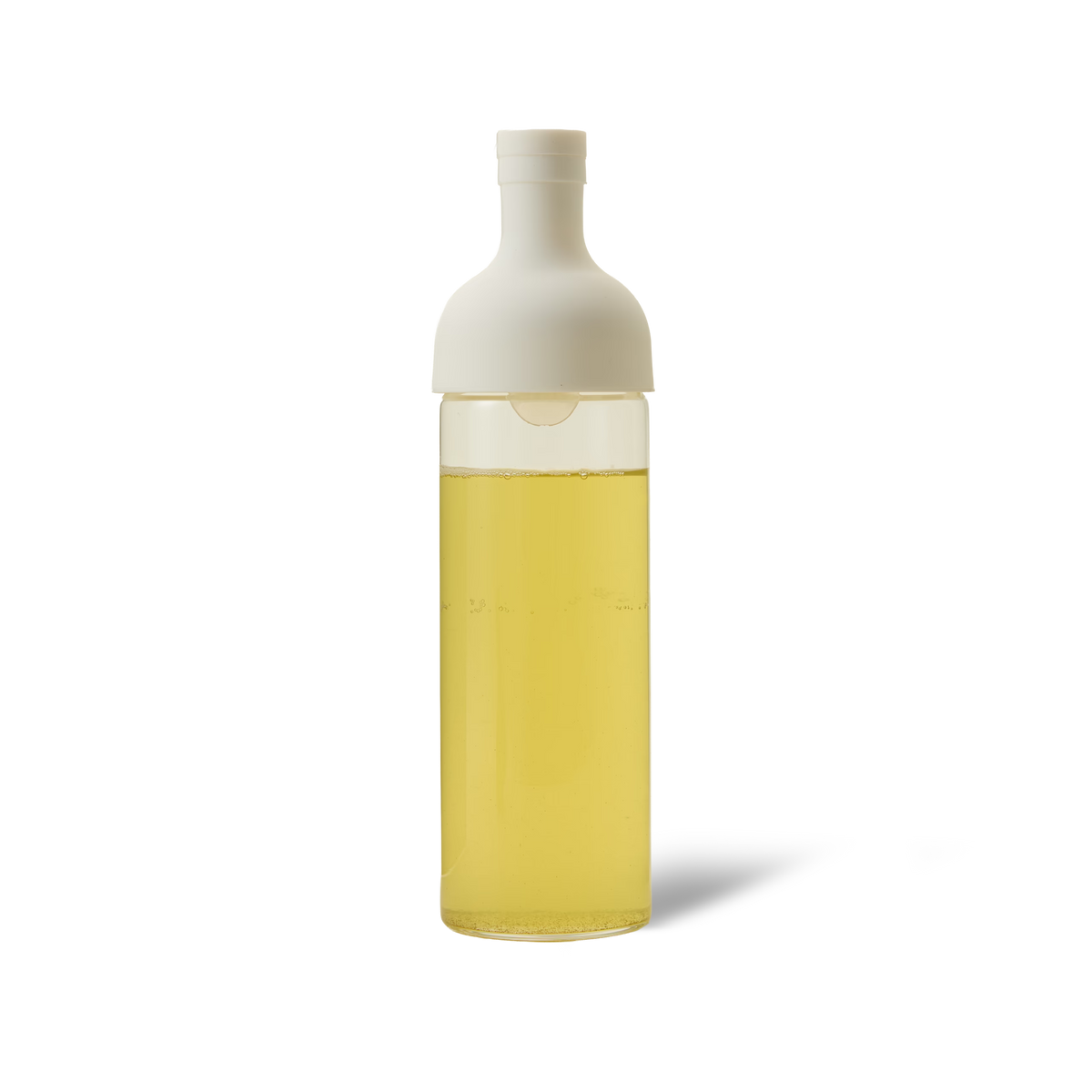 The White Hario Cold Brew Tea Bottle, filled with vibrant yellow cold brew tea and featuring a white cap, is displayed against a plain white background.