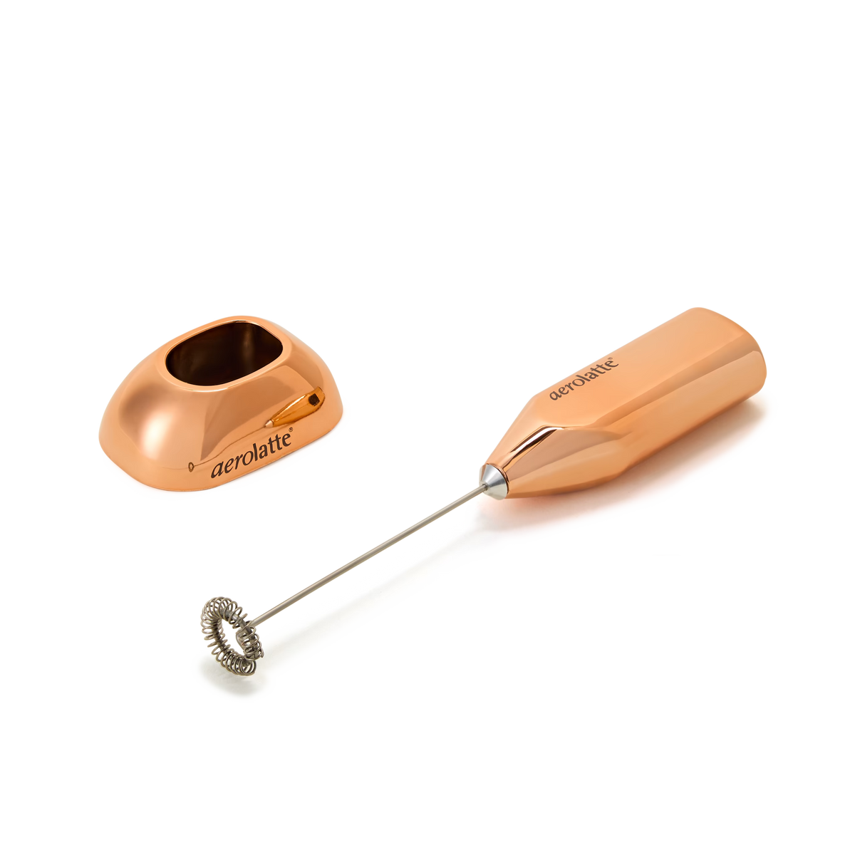 A rose gold handheld milk frother with a matching stand, both labeled aerolatte, positioned on a white background.
