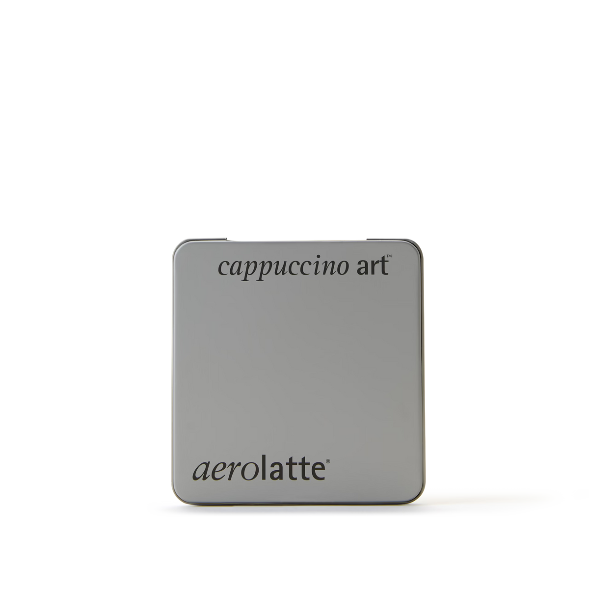 A square silver tin with cappuccino art at the top and aerolatte at the bottom, both written in black text, on a plain white background.