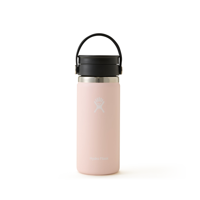 A pink Hydro Flask water bottle with a black handle and silver lid, standing upright on a plain white background.