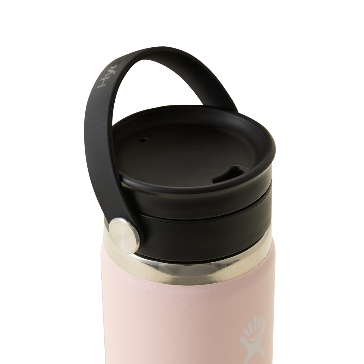 A close-up of the Trillium Hydro Flask Travel Mug in light pink, featuring a black screw-on lid with a black handle and a white logo near the base of the lid. With its sleek design reminiscent of classic Hydro Flask travel mugs, this pink insulated bottle is an ideal choice for those seeking both style and functionality on the go.