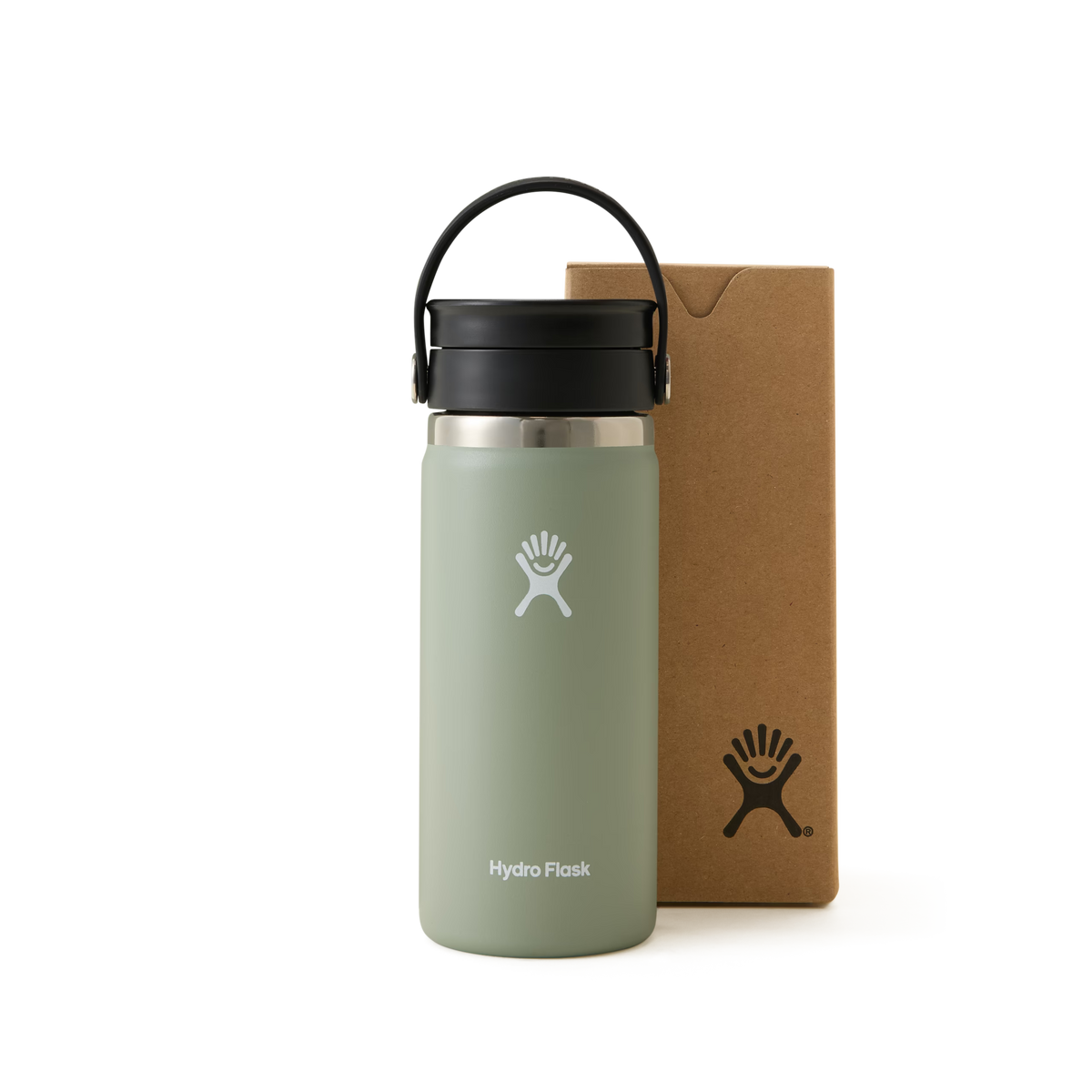 A light green Hydro Flask water bottle with a black lid and handle is standing next to a brown cardboard box, both featuring the Hydro Flask logo, against a white background.