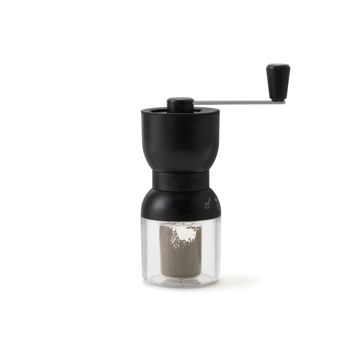 A black and clear manual coffee grinder with a hand crank, containing ground coffee in the lower transparent chamber, set against a plain white background.