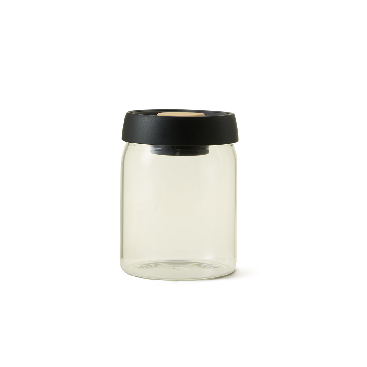 The Airtight Coffee Jar, featuring a clear glass body and a black round lid, is centered on a plain white background—making it perfect for optimal ground coffee preservation.
