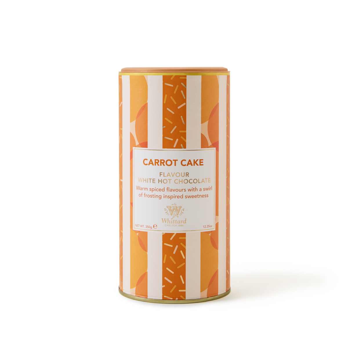 A cylindrical tin labeled Carrot Cake Flavoured Hot Chocolate, adorned with an orange and white striped pattern and sprinkles design, sits against a plain white background—ideal for savoring a cozy mug of creamy carrot cake hot chocolate.