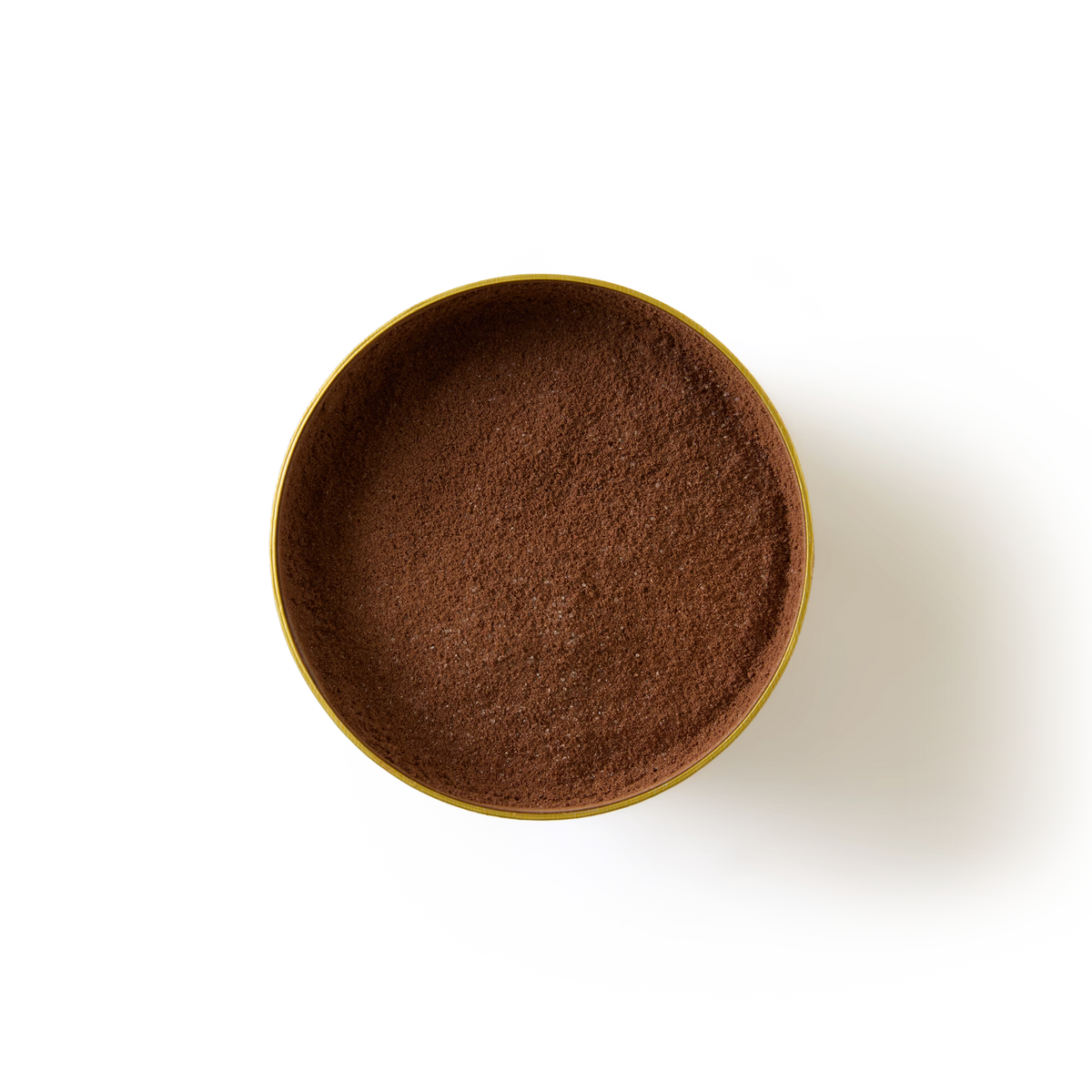 A round yellow bowl filled with finely ground brown Mint Flavoured Hot Chocolate powder, viewed from above on a white background.