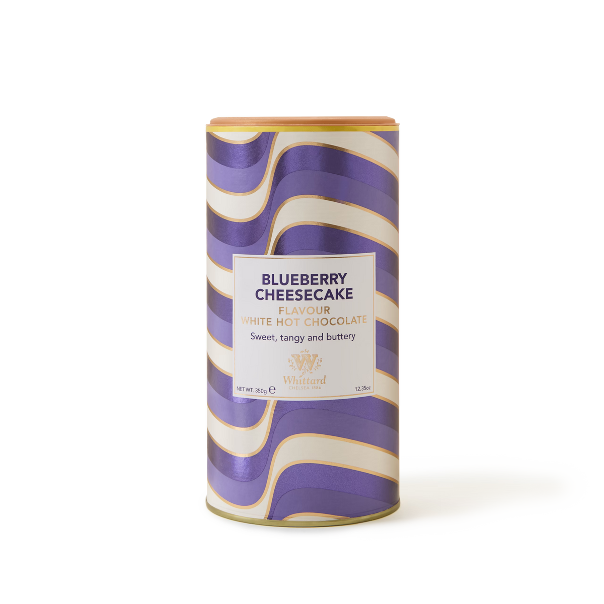 A cylindrical tin of Whittard Blueberry Cheesecake flavored white hot chocolate, with a wavy purple, gold, and white design and text label on the front.