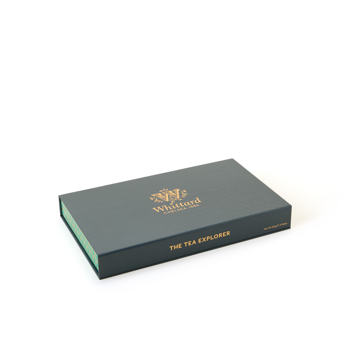 A rectangular dark green box labeled Whittard Chelsea 1886 and The Tea Explorer in gold text on the lid, set against a plain white background.