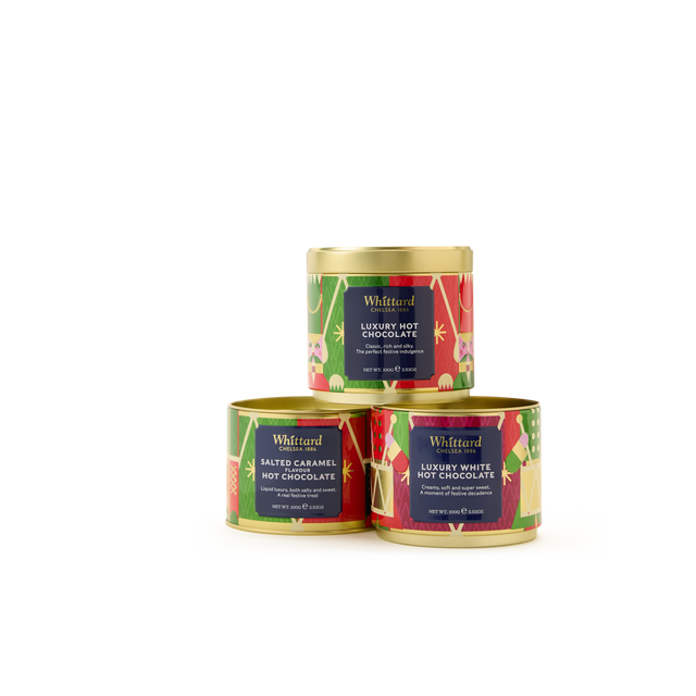 The Hot Chocolate Stacking Tin features three festive Whittard tins—Luxury, Luxury White, and Salted Caramel—stacked in a pyramid with vibrant green and red holiday-themed packaging. This delightful set makes the perfect gift for any occasion. Indulge in this deliciously festive hot chocolate collection for a truly memorable treat.