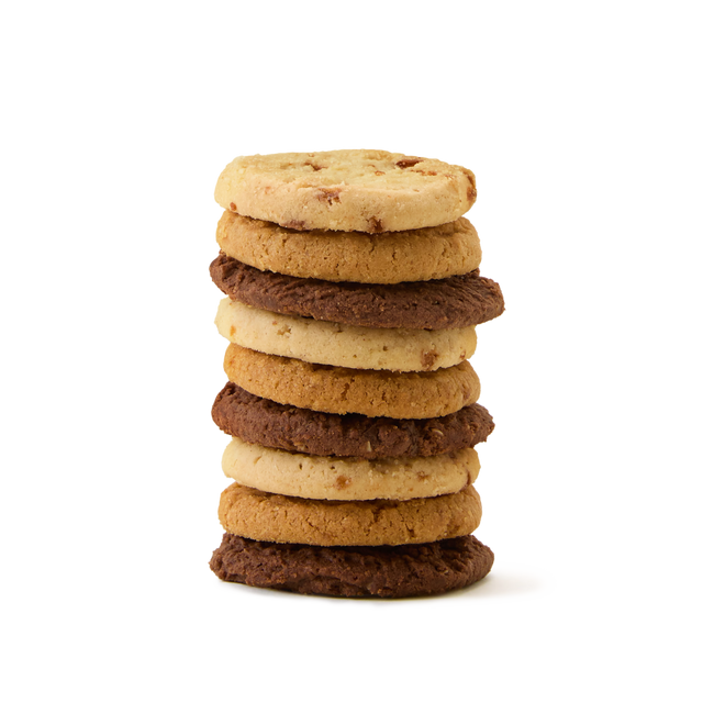 A stack of eight assorted cookies, alternating between light and dark varieties, arranged neatly against a plain white background.