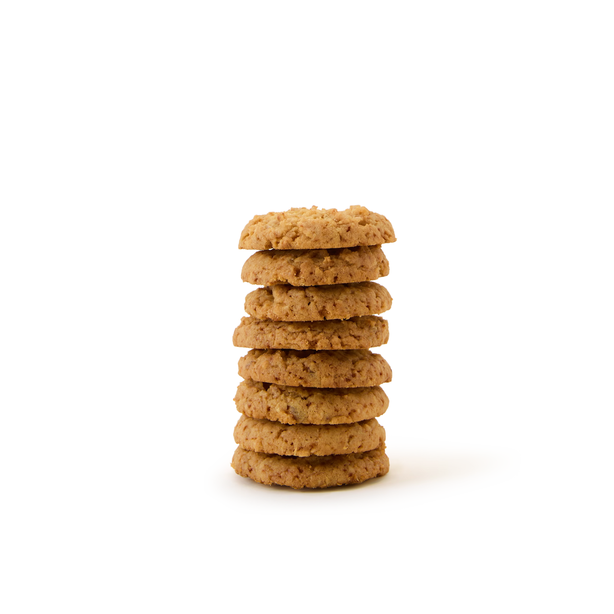 A stack of seven round, golden-brown Rhubarb and Custard Biscuits sits on a plain white background.