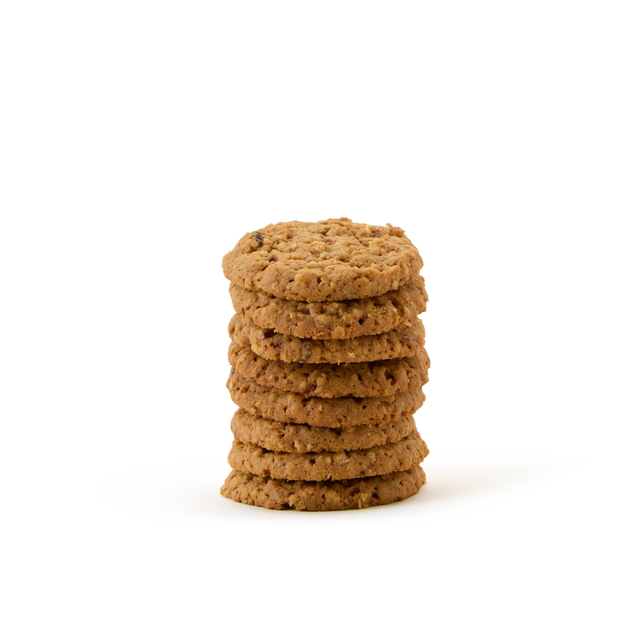A stack of seven oatmeal cookies is arranged neatly on a white background.
