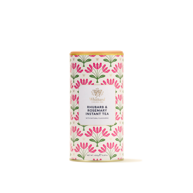 A cylindrical tin of Rhubarb & Rosemary Instant Tea, ideal for a refreshing summer beverage, adorned with a floral pink and green design on a white background.