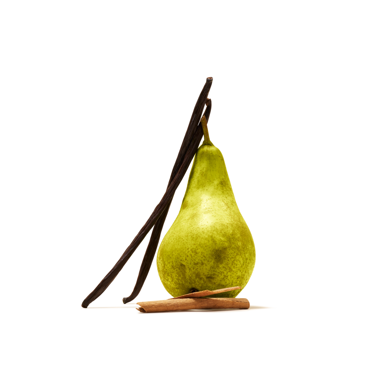 A green pear stands upright with two vanilla beans leaning against it and a cinnamon stick lying in front, all set against a white background—an inviting scene that perfectly reflects the essence of our Spiced Pear Flavour Instant Tea, a limited edition blend inspired by autumn flavours.