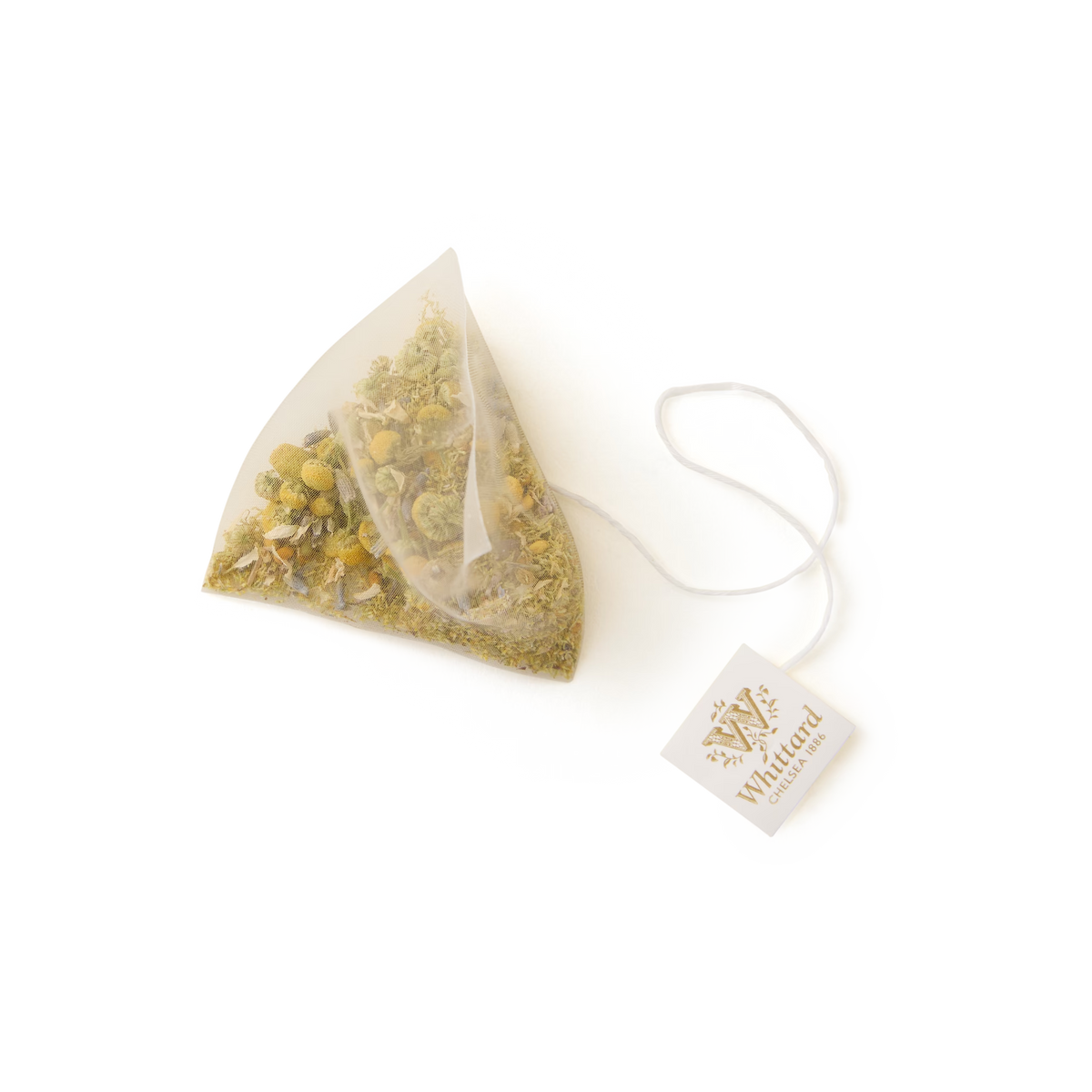 A single Camomile, Lavender and Bee Pollen Pyramid Teabag, filled with a soothing blend of loose botanicals for a calming caffeine-free tea, is attached to a string with a branded tag and displayed on a plain white background.