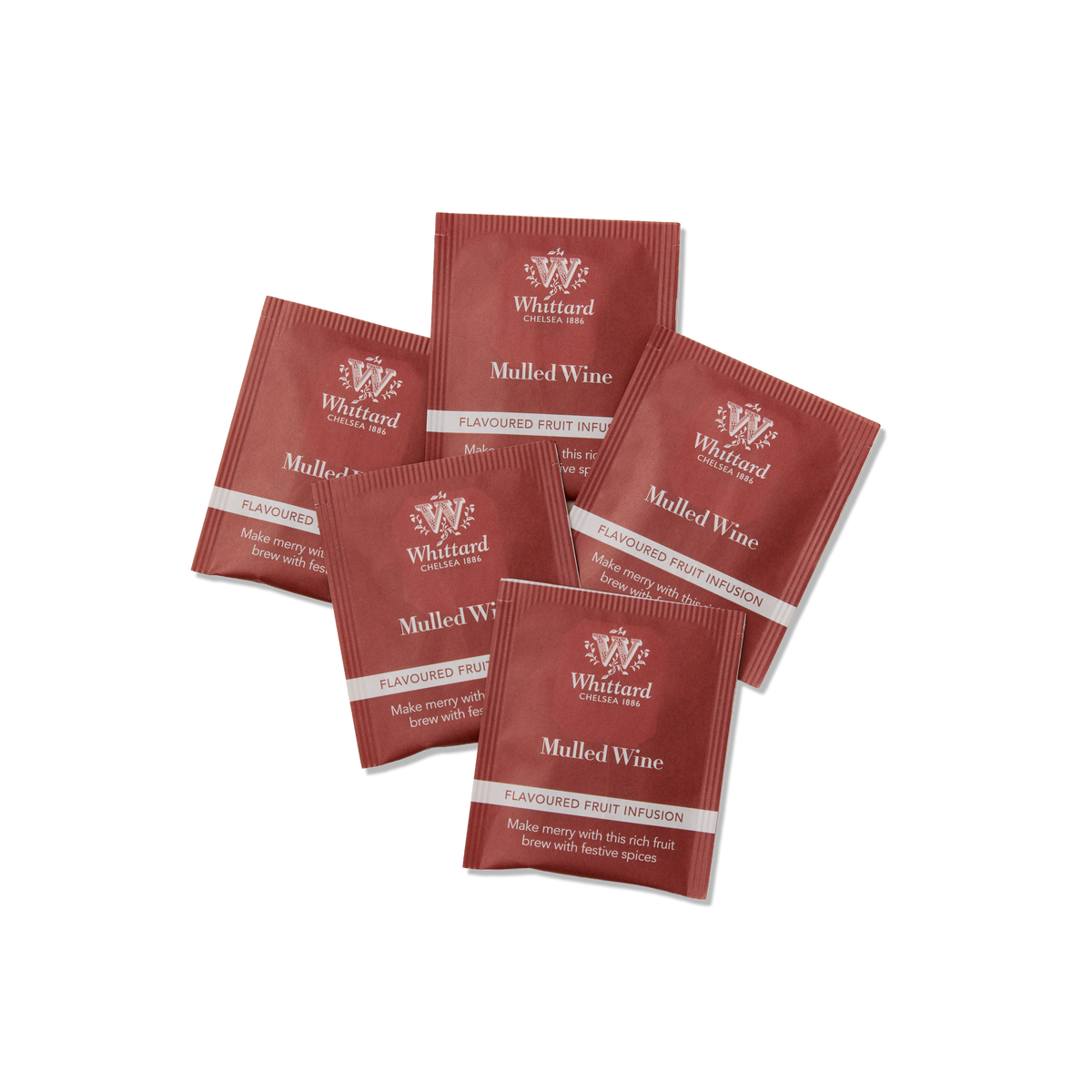 Five red Whittard Mulled Wine flavored fruit infusion tea sachets are arranged in a scattered pattern on a white background.