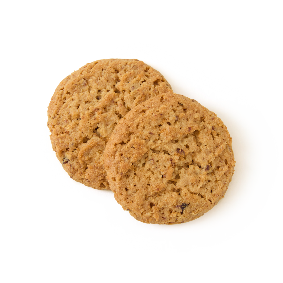 Two round, golden-brown oatmeal cookies with a slightly rough texture are overlapping on a plain white background.