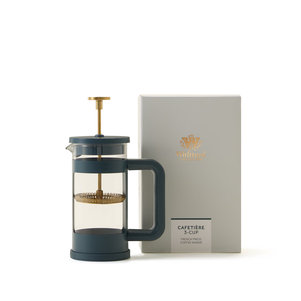 A dark blue 3-Cup Blue Cafetiere with a gold plunger stands next to a light grey box labeled 3-Cup Blue Cafetiere and Whittard in gold lettering.