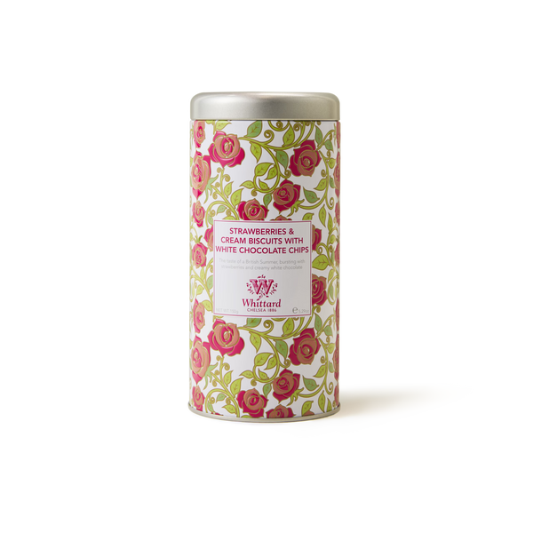 A floral tin of Tea Discoveries Strawberries & Cream All Butter Biscuits, adorned with pink and green rose designs on a white background—these classic British biscuits offer a delightful blend of sweet strawberries and creamy white chocolate in every bite.