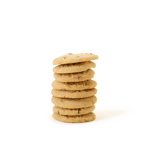 A stack of Tea Discoveries Strawberries & Cream All Butter Biscuits is arranged on a plain white background, reminiscent of classic British biscuits enjoyed with afternoon tea.