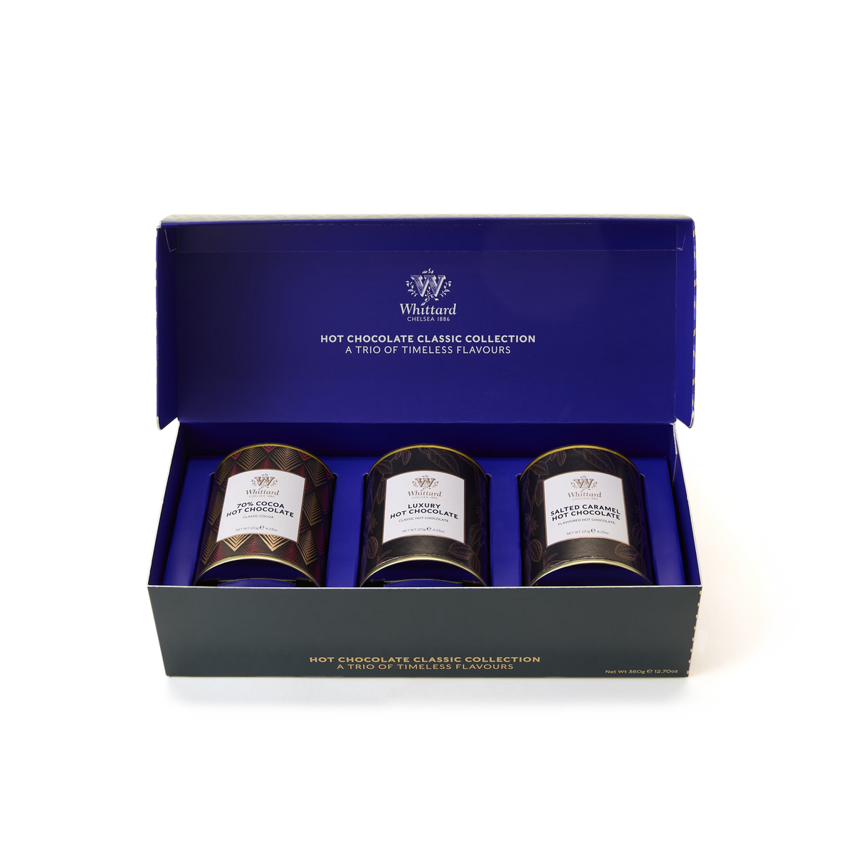 The Hot Chocolate Classic Collection features three tins of Whittard hot chocolate—Luxury Hot Chocolate, Salted Caramel, and 70% Cocoa Hot Chocolate—beautifully displayed in an open blue and black gift box.