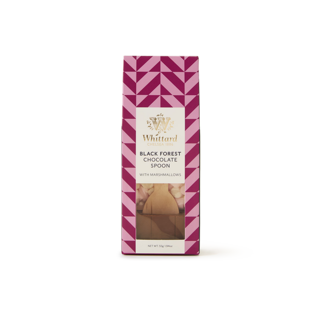 A pink geometric box of Black Forest Flavour Chocolate Spoon with Marshmallows is displayed. The packaging highlights a hot chocolate spoon and mini marshmallows visible through a clear window, ideal for stirring into hot milk to create a rich Black Forest hot chocolate.