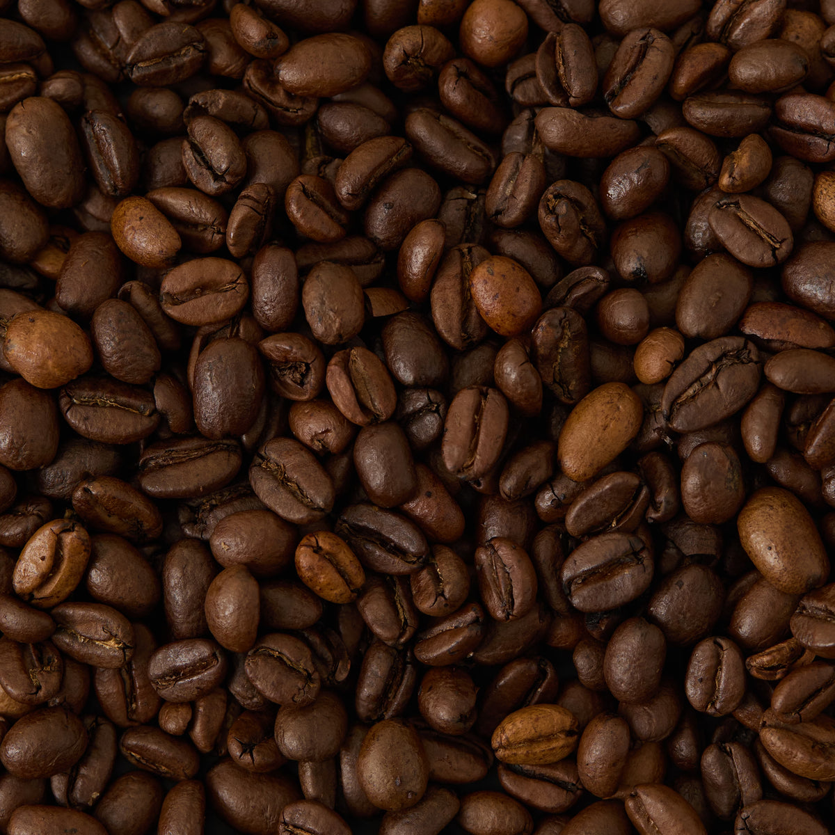A close-up view of roasted Limited Edition African Moon Coffee beans from the Rwenzori Mountains.