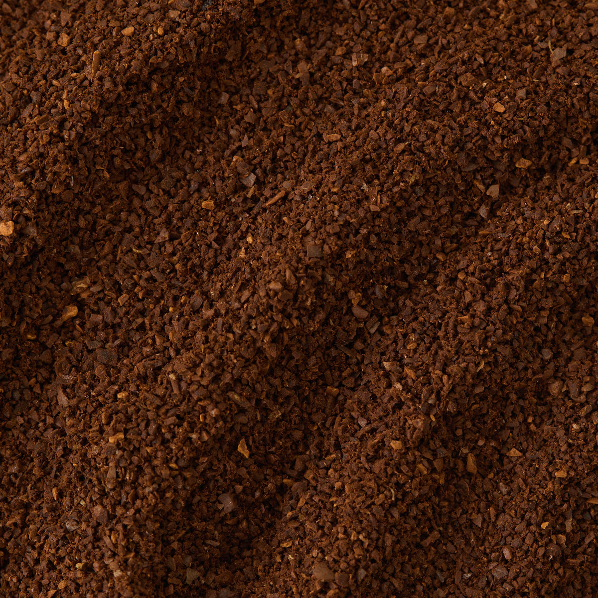 Close-up view of medium-dark Limited Edition African Moon Coffee grounds.