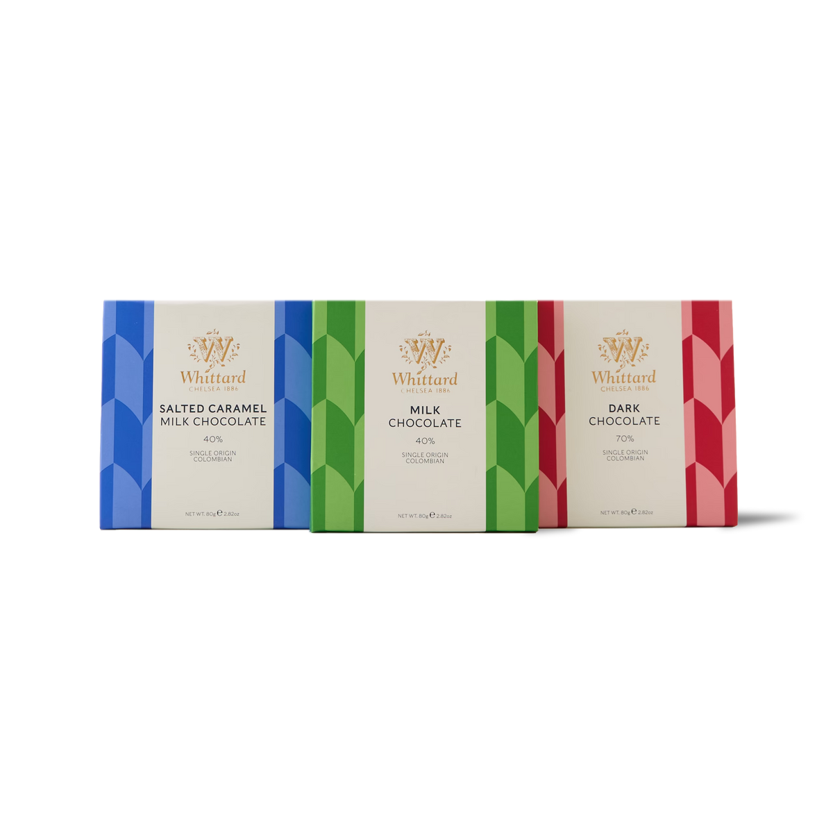 The Chocolate Bar Trio features three luxurious Whittard chocolate bars—Salted Caramel Milk Chocolate, Milk Chocolate, and Dark Chocolate—presented side by side in distinctive geometric-patterned wrappers (blue, green, and red). Crafted with single origin Colombian cocoa, this trio promises an indulgent and richly flavoured tasting experience.