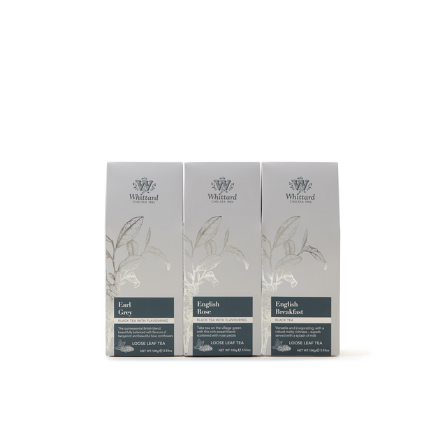 Three silver-grey boxes from the Best Selling Loose Leaf Tea Selection—featuring Earl Grey, English Rose, and English Breakfast—are arranged side by side against a plain white background.