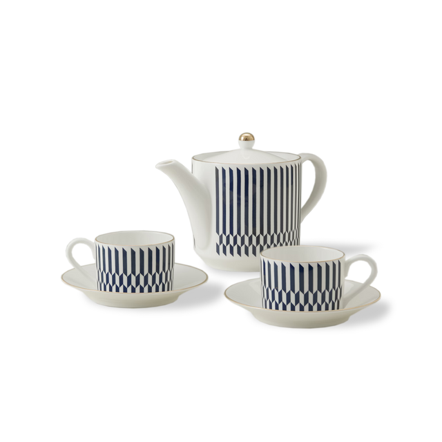 The Chelsea Collection Sloane Tea Set features a white porcelain teapot with a gold-tipped lid, accompanied by two matching teacups and saucers. Each piece is adorned with vertical navy blue stripes and finished with 22ct gold detailing. This elegant afternoon tea set, exemplifying British ceramic craftsmanship, is showcased against a plain white background.