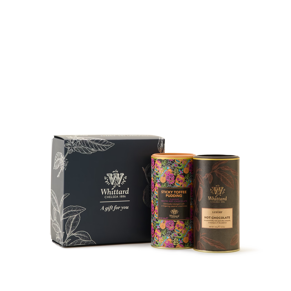 Introducing the Delicious Hot Chocolate Duo Gift Box, featuring two tins—Sticky Toffee Pudding and Luxury Hot Chocolate—each in vibrant packaging displayed on a white background. The perfect hot chocolate gift for any occasion, it’s an indulgent treat that delivers a uniquely personal hot chocolate experience in every cup.