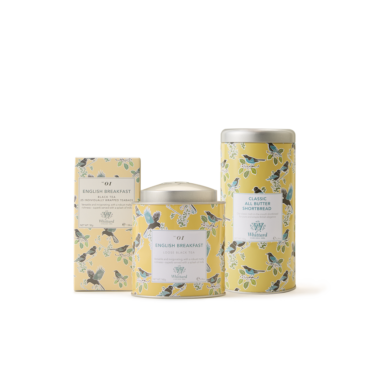 Three yellow floral-patterned containers—a rectangular English Breakfast tea box, a round loose leaf tin, and a tall Classic All Butter Shortbread tin—make up The English Breakfast Collection, a delightful set that’s perfect as a British tea gift. Displayed against a crisp white background, this elegant collection embodies the timeless charm of traditional English Breakfast tea.