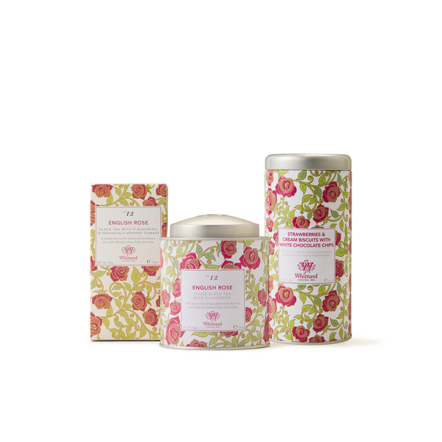 The English Rose Collection features three floral-designed tins and boxes adorned with pink and green rose patterns, perfect for a tea gift set, containing English Rose tea and Strawberries & Cream Biscuits with White Chocolate Chips.