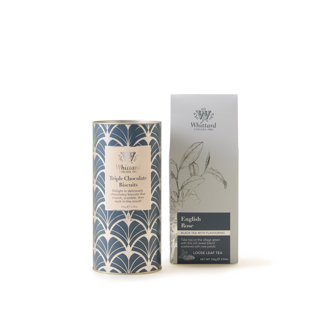 A tin of Whittard’s English Rose Loose Tea and Triple Chocolate Biscuits—beautifully presented in elegant, patterned packaging—are displayed side by side against a plain white background, making a perfect floral chocolate gift.