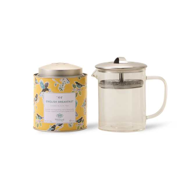 The Greenwich Tea Collection, featuring a tin of English Breakfast loose leaf tea in a floral yellow design and a clear Greenwich Teapot with a metal lid and built-in strainer, makes a lovely personalised tea gift for any occasion.