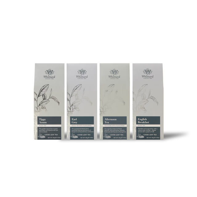 Four Whittard tea packages—Tippy Assam, Earl Grey, Afternoon Tea, and English Breakfast—stand side by side on a white background. Each package features botanical illustrations and a minimalist gray and white design, making them the perfect choice for black tea lovers seeking the convenience of The Time for Tea Subscription.