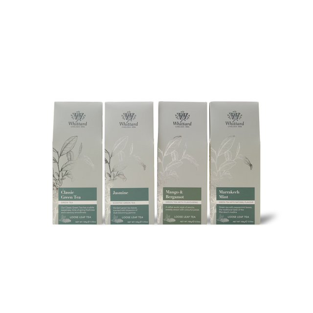 Four silver tea packages from Whittard’s The Green Tea Subscription—Classic Green Tea, Jasmine, Mango & Bergamot, and Marrakech Mint—are displayed side by side against a white background.