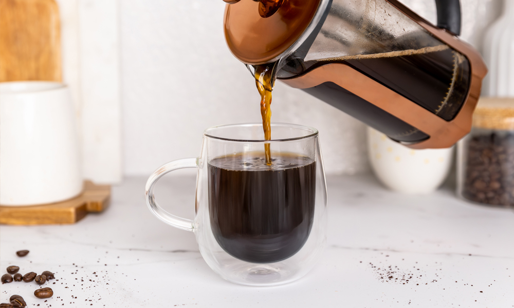 Whittard of Chelsea cafeteire being used to pour coffee into glass mug